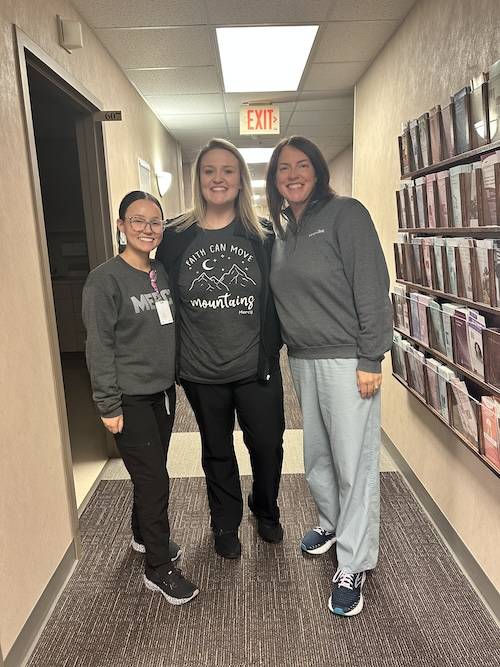 Preceptor Faith Jones (right) with students.